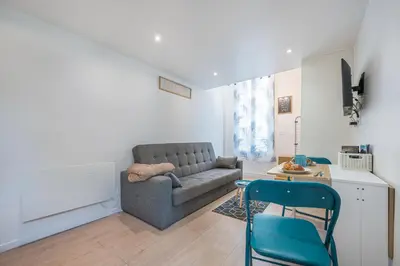 a living room with a couch and a table at Blue Escape Nice in Nice