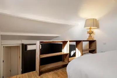 a bedroom with a bed and a desk at Séjour de luxe sur les collines niçoises in Nice