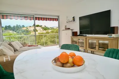 a bowl of fruit on a table in a living room at Beautiful 3-room apartment with terrace in Nice