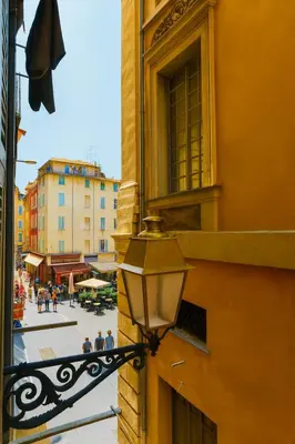 a street light on the side of a building at Studio Masséna - Mer et Vieux Nice pour 4 personnes in Nice