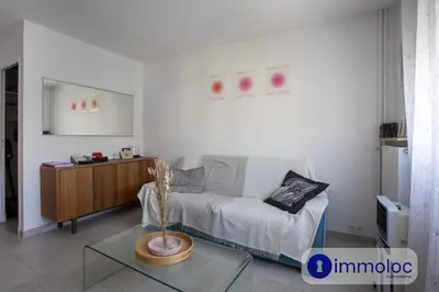 a room with a bed and a glass table in it at Studio near airport in Nice