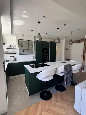 a kitchen with green cabinets and a white counter top at Beautiful 2-room, AC, Center, terrace in Nice