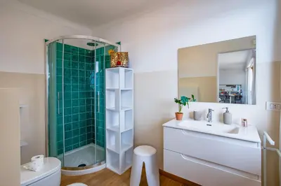 a bathroom with a shower and a sink and a toilet at Dina palace AP4462 By Riviera Holiday Homes in Villefranche-sur-Mer
