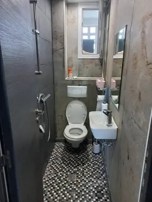 a small bathroom with a toilet and a sink at Nice Signature Caucade in Nice