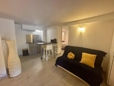a living room with a couch and a table at Nice Signature Bellet in Nice