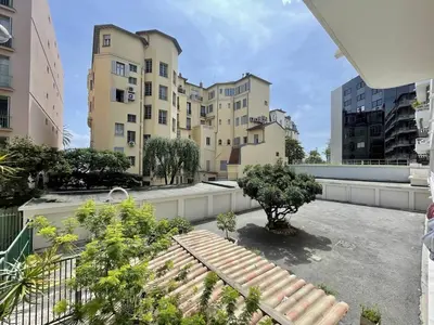 a balcony with a bench and some buildings at Nice Signature Andrioli in Nice