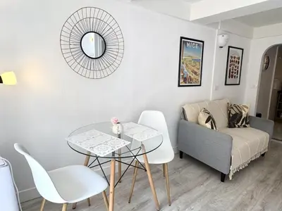 a living room with a table and a couch at A OT Cocon d Augustin Old Town Nice Center in Nice