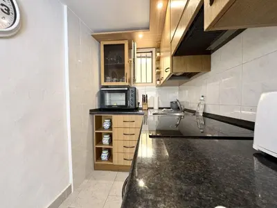 a kitchen with a sink and a microwave at A OT Cocon d Augustin Old Town Nice Center in Nice