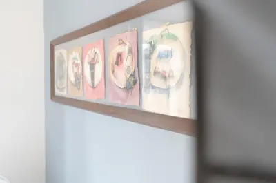 a row of plates on a shelf at Guest House La Niçoise in Nice