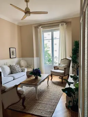 a living room with a couch and a table at Cocon chic au cœur de la ville in Nice