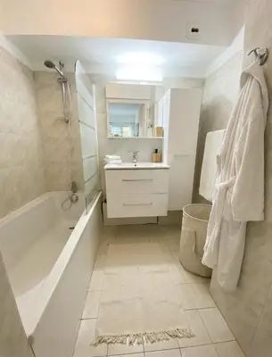 a bedroom with a bed and a hallway at Studio with Terrace near Beach in Nice
