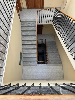 a set of stairs in a building at Renovated luxury cocoon Place Masséna in Nice