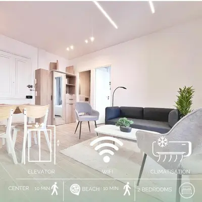 a living room with a couch and a table at RF 121 Close to port 2 bedrooms 2 toilets in Nice