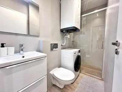 a white bathroom with a toilet and a sink at RF 121 Close to port 2 bedrooms 2 toilets in Nice
