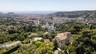 an aerial view of a city with buildings at VILLA MONTE CRISTO - Villa conviviale a Nice - Superbe vue, piscine et jeux en plein air in Nice