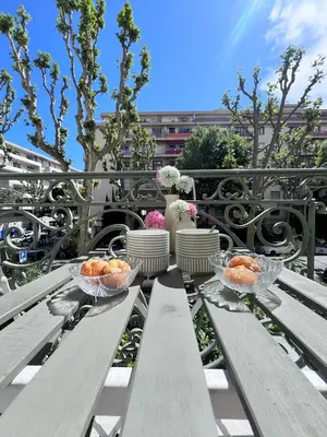two bowls of fruit sitting on a wooden bench at Ref 118 Oliviera 2 Beds Apartment in Riquier in Nice
