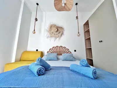 a bedroom with a blue bed with blue pillows at Ref 118 Oliviera 2 Beds Apartment in Riquier in Nice