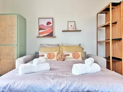a bedroom with a bed with towels on it at Ref 119 - Slow Riviera T2 - Rue de France in Nice