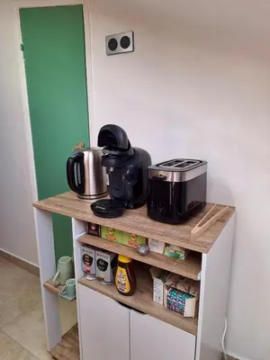 a kitchen with a counter with a toaster and a appliance at Lofty Hideout with 2 bedrooms in Nice