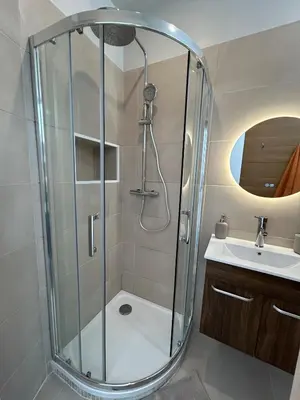 a bathroom with a shower and a sink at Central studio and sun terrace in Nice