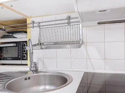 a kitchen with a sink and a microwave at Apartment Daphné by Interhome in Nice