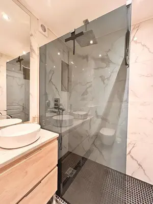 a bathroom with two sinks and a shower at Near Port & City - Private Parking & Breakfast - Full apartment in Nice