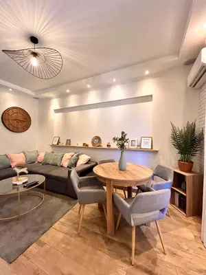 a living room with a couch and a table at Near Port & City - Private Parking & Breakfast - Full apartment in Nice