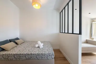 a bedroom with a bed with a teddy bear on it at Magnifique studio boulevard gambetta - A in Nice