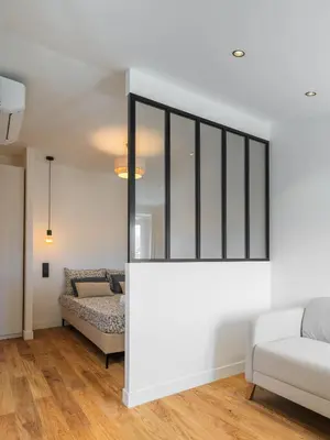 a living room with white walls and a couch at Magnifique studio boulevard gambetta - A in Nice