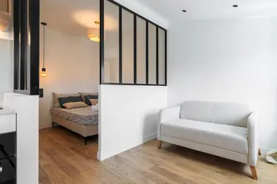 a living room with a white couch and a chair at Magnifique studio boulevard gambetta - A in Nice