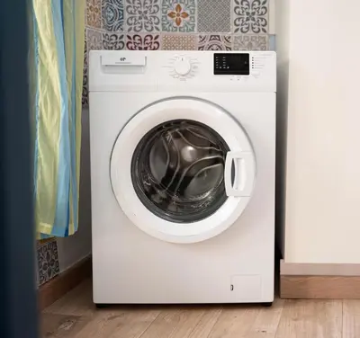 a white washing machine sitting in a room at Rêve Bleu de Nice - Terrace - Beach & Tram 5 min in Nice