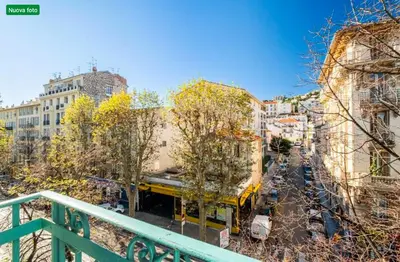 a yellow truck is parked on a city street at The cozy corner of Amelie in Nice