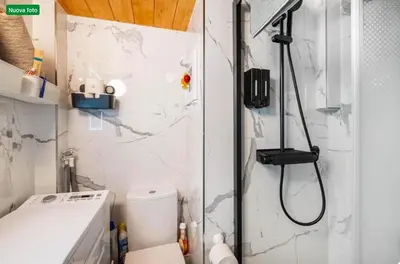 a small bathroom with a shower and a toilet at The cozy corner of Amelie in Nice