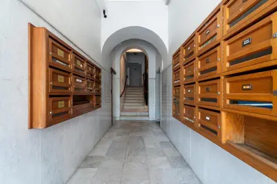 a hallway with wooden horse stalls in a building at Nice Renting - VERDUN - Designer Cocoon Massena Calm Air Conditioning in Nice