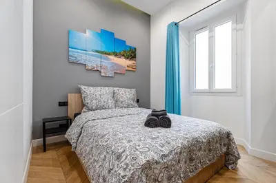 a bedroom with a bed and a window at Nice Renting - VERDUN - Designer Cocoon Massena Calm Air Conditioning in Nice