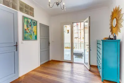 a room with a blue dresser and a mirror at EDEN VIEW AP4469 by Riviera Holiday Homes in Villefranche-sur-Mer
