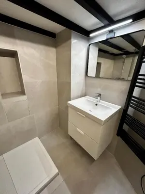 a bathroom with a sink and a mirror at Appartement LOFT in Nice