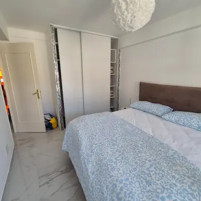 a bedroom with two beds and a closet at Bahri House in Nice