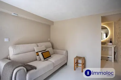 a living room with a couch and a table at Studio in Villefranche in Villefranche-sur-Mer