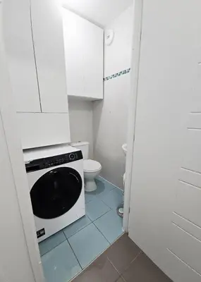 a small bathroom with a toilet and a microwave at Nice Riquier 8 in Nice