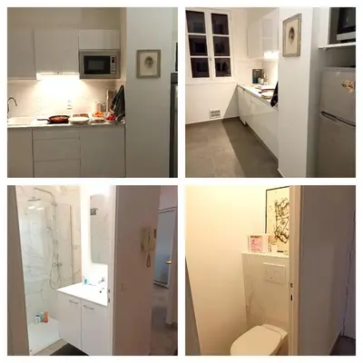 a kitchen with white cabinets and a refrigerator at Port de Nice-charmant appartement bucolique ! vue port in Nice