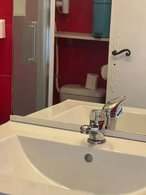 a bathroom sink with a large mirror and a sink at Studio à 5min de la plage in Nice