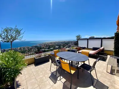 a patio with a table and chairs on a balcony at Nice Ouest-Splendide 3p, Roof-Terrace Panoramic Sea View in Nice