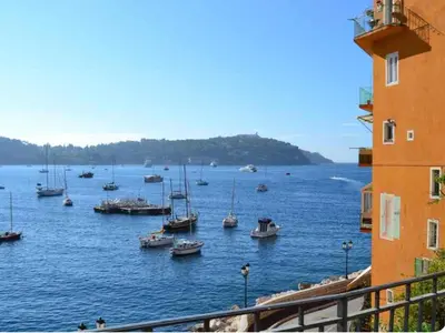 a group of boats in a large body of water at Villefranche in Villefranche-sur-Mer