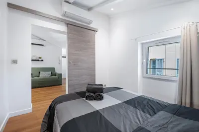 a bedroom with a bed with a camera on it at Nice Renting - 6B FRANCE - Massena beach design AC quiet center wifi in Nice