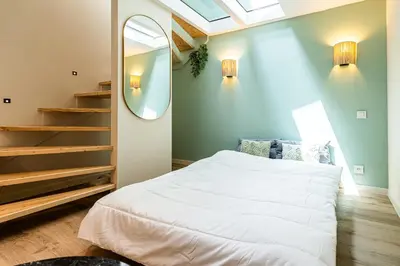 a bedroom with a bed and a mirror at La Vila-Vielha in Nice