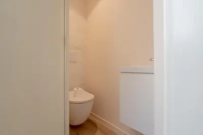 a bathroom with a toilet and a sink at La Vila-Vielha in Nice
