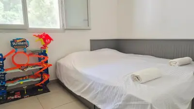 a bedroom with a bed with a lego toy on it at T4 avec grande terrasse - BBQ - parking in La Trinité