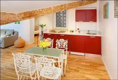 a kitchen with a table and chairs in a room at 1 bedroom, Best location in Nice in Nice