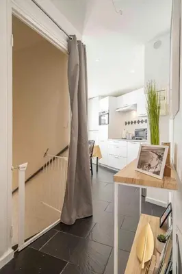 a living room with a sliding door in a kitchen at Modern and elegant, air-conditioned, city centre - HDP2 in Nice